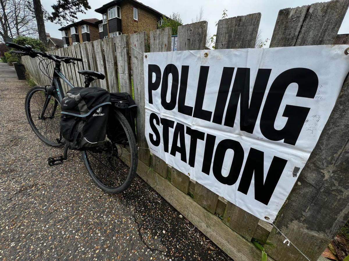 Bicycle next to sign saying 'Polling Station'